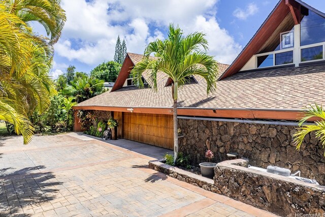337 Wanaao Rd, Kailua, HI 96734 - view of property exterior with roof with shingles and stone siding