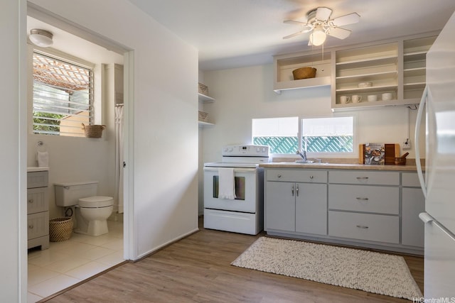 337 Wanaao Rd, Kailua, HI 96734 - kitchen with white appliances, open shelves, light wood-style floors, light countertops, and ceiling fan