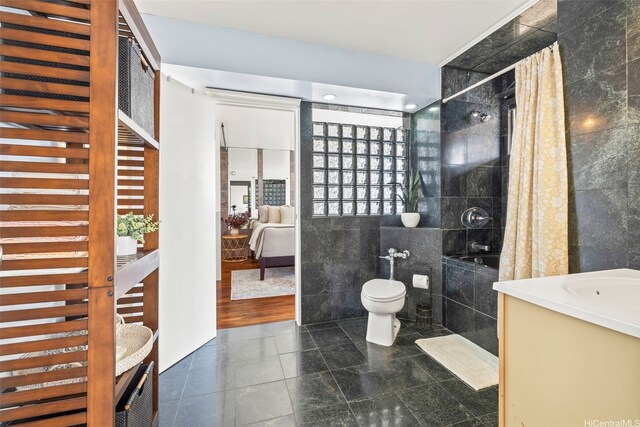 2754 Kuilei St Unit 2002, Honolulu, HI 96826 - bathroom with tile walls, toilet, tile patterned floors, tiled shower / bath combo, and vanity