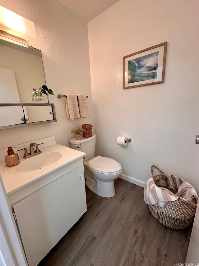 92-993 Makakilo Dr Unit 45, Kapolei, HI 96707 - half bathroom featuring wood finished floors, toilet, vanity, and baseboards