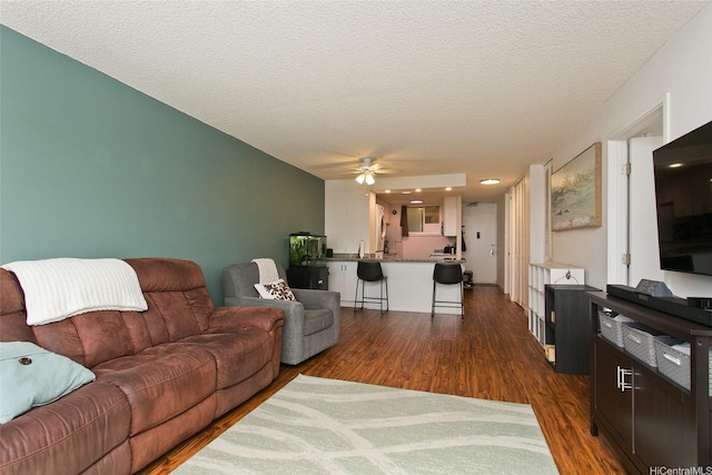 750 Kaheka St Unit 1406, Honolulu, HI 96814 - living room featuring dark wood-style floors, a ceiling fan, and a textured ceiling