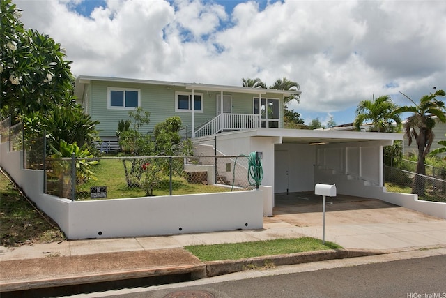 92-675 Wainohia Pl, Kapolei, HI 96707 - view of front facade featuring a fenced front yard, driveway, and a carport