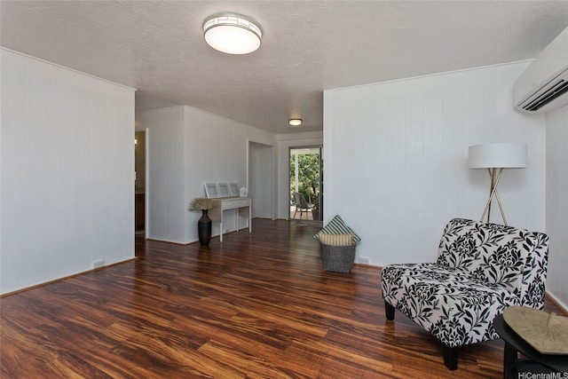 92-675 Wainohia Pl, Kapolei, HI 96707 - living area featuring wood finished floors, a wall mounted air conditioner, and a textured ceiling