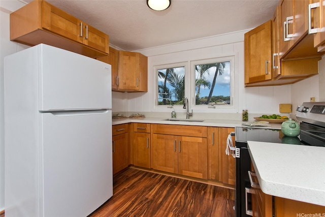 92-675 Wainohia Pl, Kapolei, HI 96707 - kitchen featuring freestanding refrigerator, stainless steel range with electric cooktop, a sink, dark wood finished floors, and light countertops