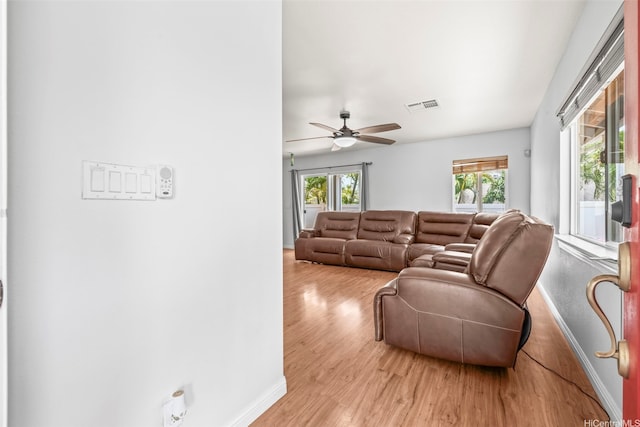 92-325 Palaulau Pl Unit 62, Kapolei, HI 96707 - living area featuring baseboards, healthy amount of natural light, wood finished floors, and a ceiling fan