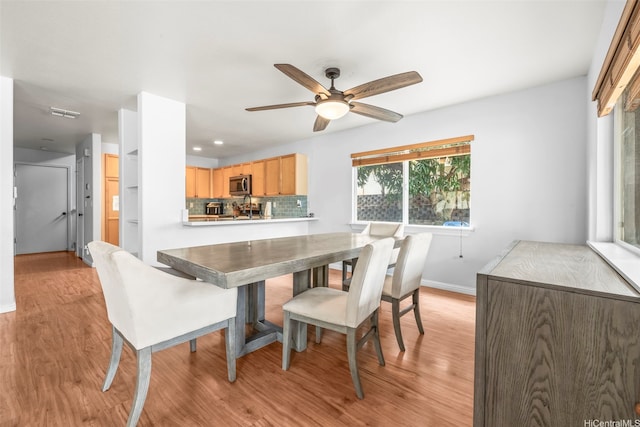 92-325 Palaulau Pl Unit 62, Kapolei, HI 96707 - dining room with light wood-style flooring, baseboards, ceiling fan, and recessed lighting