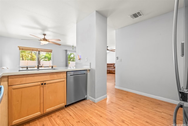 92-325 Palaulau Pl Unit 62, Kapolei, HI 96707 - kitchen with dishwasher, ceiling fan, light wood-style flooring, and light countertops