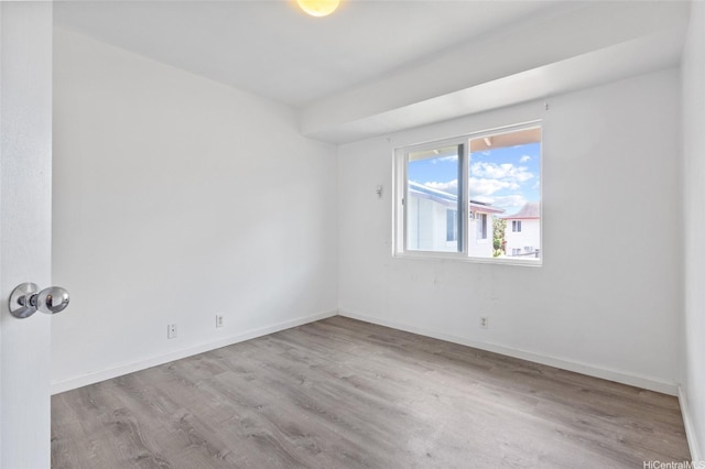 91-1028 Laulauna St Unit 9A, Ewa Beach, HI 96706 - spare room with wood finished floors and baseboards