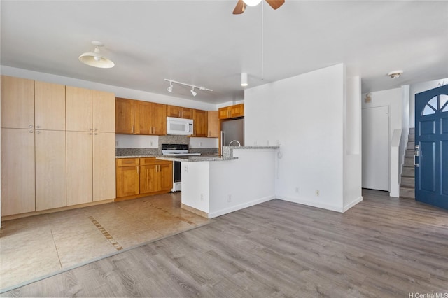 91-1028 Laulauna St Unit 9A, Ewa Beach, HI 96706 - kitchen with white appliances, a peninsula, a ceiling fan, and wood finished floors