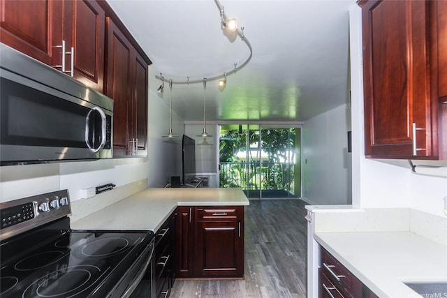 3161 Ala Ilima St Unit 206, Honolulu, HI 96818 - kitchen featuring stainless steel appliances, reddish brown cabinets, and light countertops
