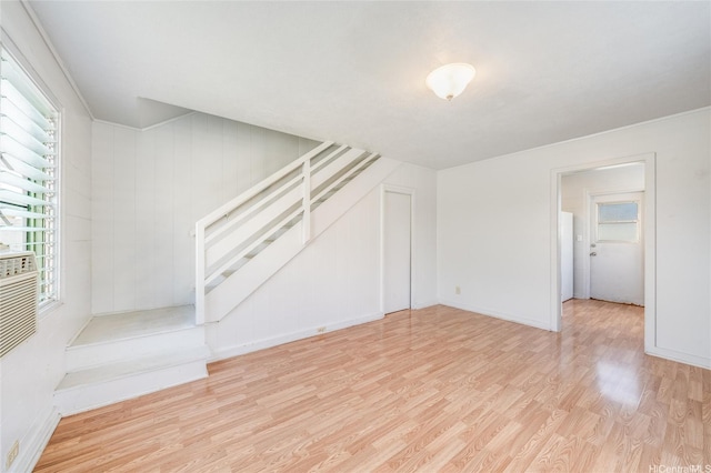 713 Menehune Ln, Honolulu, HI 96826 - unfurnished living room featuring stairs, wood finished floors, and baseboards