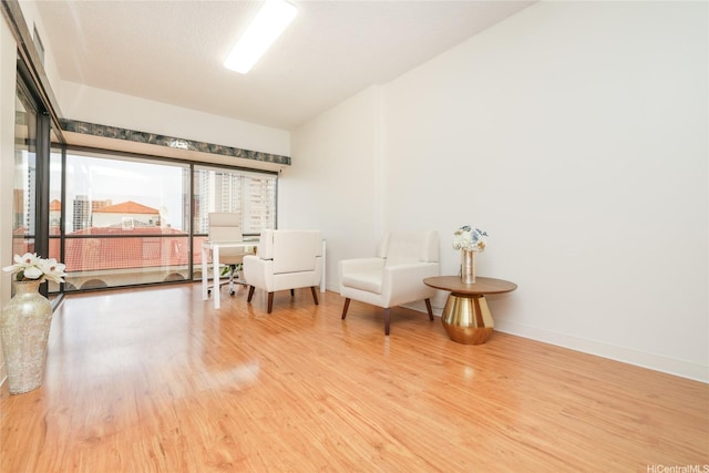 1188 Bishop St Unit 910, Honolulu, HI 96813 - living area with wood finished floors and baseboards
