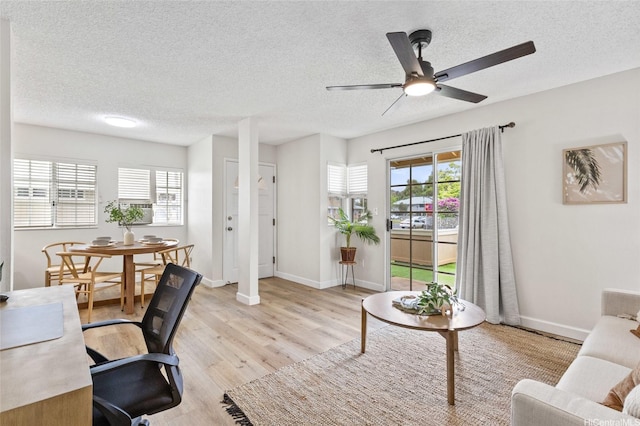 91-1050 Makaaloa St Unit 11E, Ewa Beach, HI 96706 - office space with a textured ceiling, light wood-type flooring, a ceiling fan, and baseboards