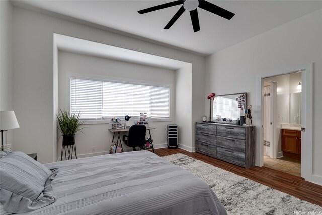 91-1067 Hoomahana St, Ewa Beach, HI 96706 - bedroom featuring wood finished floors, ensuite bath, ceiling fan, and baseboards