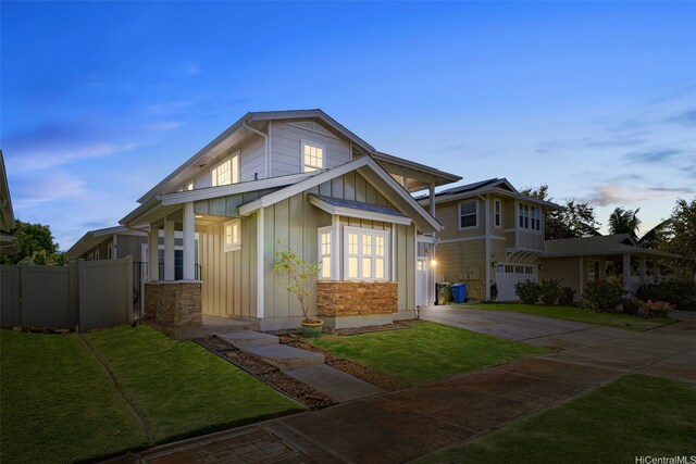 91-1067 Hoomahana St, Ewa Beach, HI 96706 - view of front of house with board and batten siding and driveway
