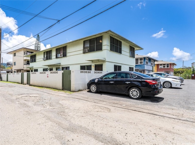 713 Menehune Ln, Honolulu, HI 96826 - multi unit property with fence, uncovered parking, and cooling unit