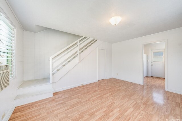 713 Menehune Ln, Honolulu, HI 96826 - unfurnished living room featuring stairs, wood finished floors, and baseboards