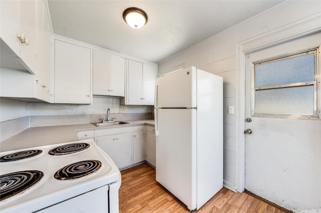 713 Menehune Ln, Honolulu, HI 96826 - kitchen featuring white appliances, a sink, light wood-type flooring, white cabinetry, and light countertops
