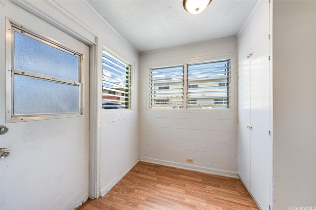 713 Menehune Ln, Honolulu, HI 96826 - spare room featuring light wood-style flooring and baseboards
