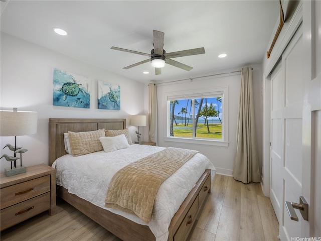 6173 Summer St, Honolulu, HI 96821 - bedroom with light wood-style flooring, recessed lighting, a closet, and a ceiling fan
