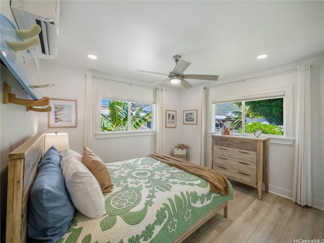 6173 Summer St, Honolulu, HI 96821 - bedroom with light wood-style flooring, recessed lighting, a ceiling fan, and a wall mounted air conditioner