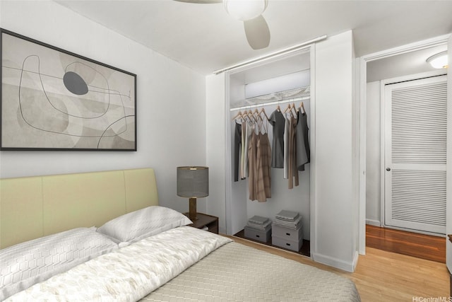 bedroom featuring wood finished floors, a closet, and ceiling fan