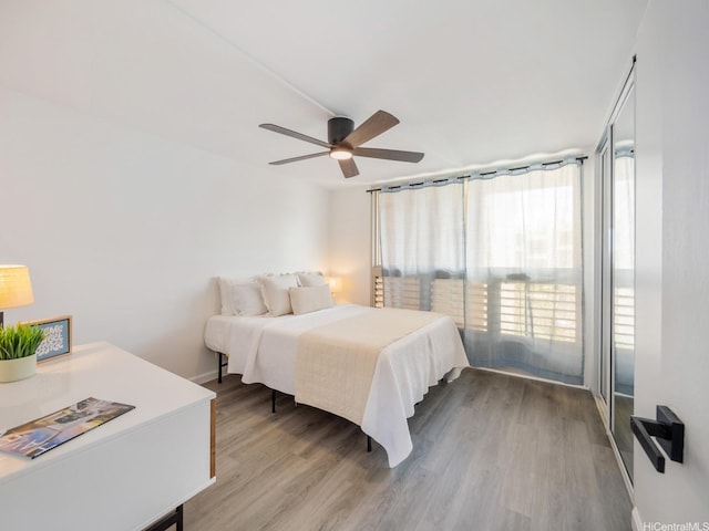 68-024 Apuhihi St Unit W511, Waialua, HI 96791 - bedroom featuring wood finished floors, ceiling fan, and baseboards