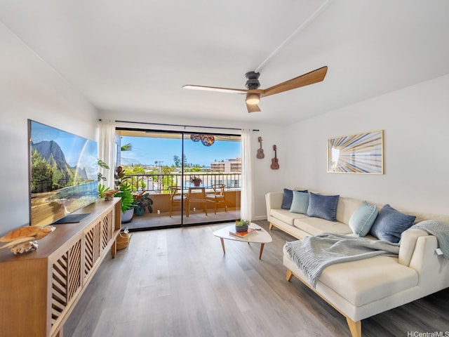 68-024 Apuhihi St Unit W511, Waialua, HI 96791 - living area featuring wood finished floors and a ceiling fan