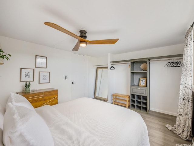 68-024 Apuhihi St Unit W511, Waialua, HI 96791 - bedroom with wood finished floors, a ceiling fan, and baseboards