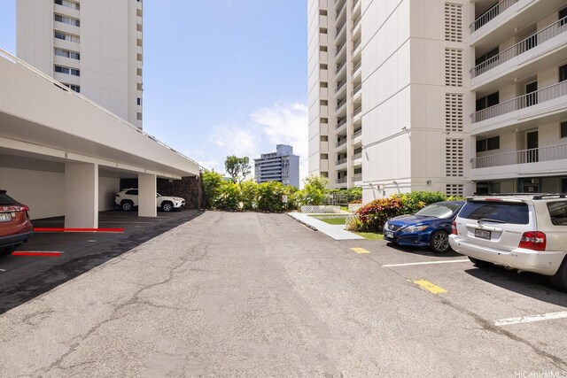 1515 Ward Ave Unit 304, Honolulu, HI 96822 - partially covered parking lot with a view of city