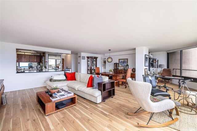 1910 Ala Moana Blvd Unit 35C, Honolulu, HI 96815 - living room with wood finished floors and a desk