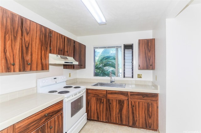 98-630 Moanalua Loop Unit 219, Aiea, HI 96701 - kitchen with white range with electric stovetop, a sink, under cabinet range hood, and light countertops