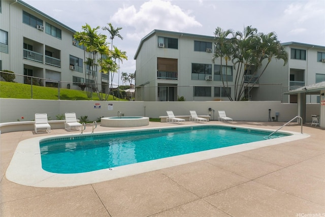 98-630 Moanalua Loop Unit 219, Aiea, HI 96701 - community pool featuring a hot tub, a patio, and fence