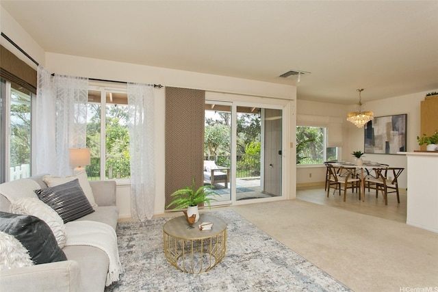 98-1970-A Kaahumanu St Unit 128, Pearl City, HI 96782 - carpeted living room featuring a chandelier and baseboards