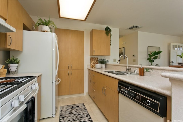 98-1970-A Kaahumanu St Unit 128, Pearl City, HI 96782 - kitchen with white appliances, a sink, light countertops, under cabinet range hood, and light tile patterned flooring
