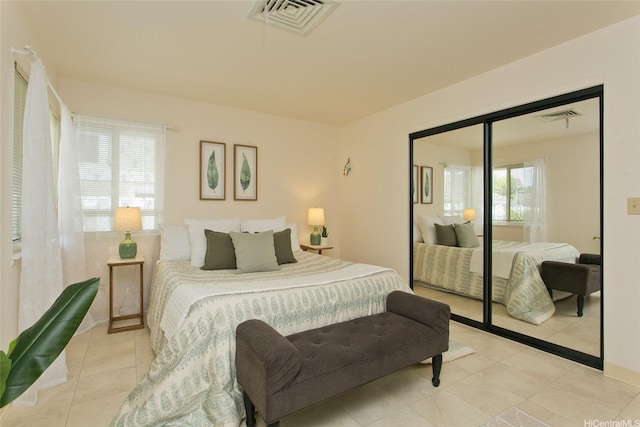 98-1970-A Kaahumanu St Unit 128, Pearl City, HI 96782 - bedroom with a closet and light tile patterned floors