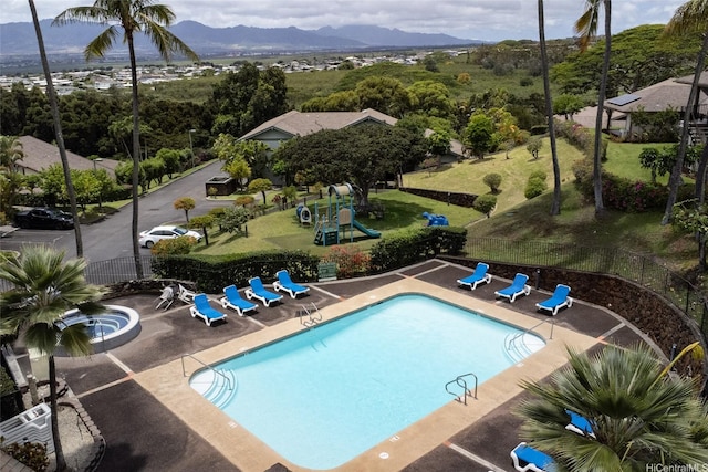 98-1970-A Kaahumanu St Unit 128, Pearl City, HI 96782 - community pool featuring a patio and a mountain view