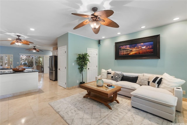 living area with ceiling fan and recessed lighting