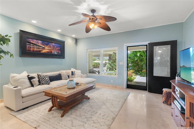 living area with a ceiling fan, baseboards, recessed lighting, and light tile patterned floors