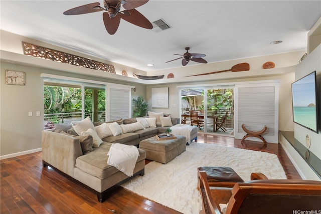 living area featuring ceiling fan, baseboards, dark wood-style flooring, healthy amount of natural light, and recessed lighting