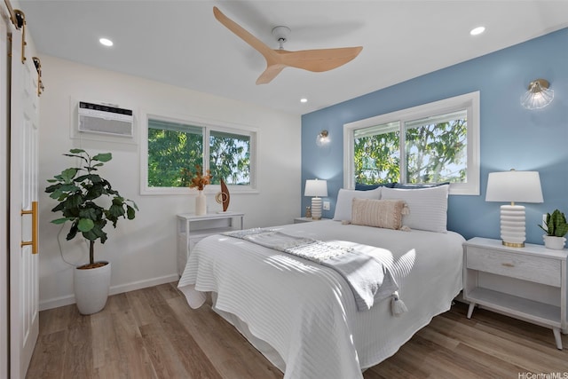 92-370 Malahuna Pl, Kapolei, HI 96707 - bedroom featuring wood finished floors, ceiling fan, a wall unit AC, baseboards, and recessed lighting