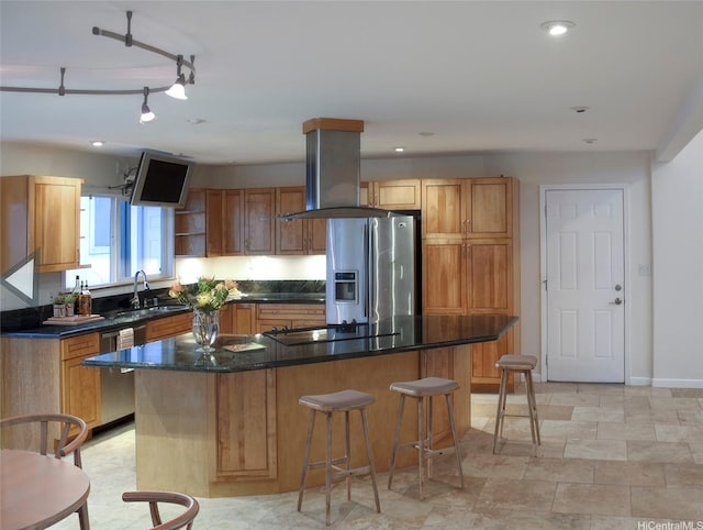 245 Hualani St Unit B, Kailua, HI 96734 - kitchen featuring appliances with stainless steel finishes, a kitchen bar, dark countertops, a sink, and island range hood