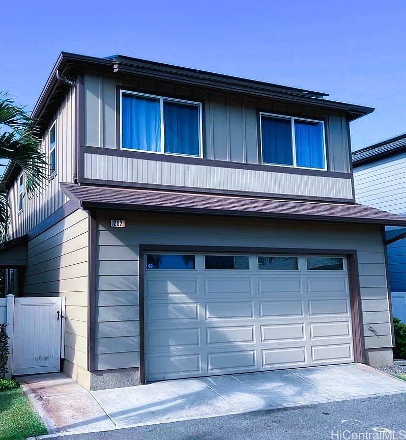 91-1160 Kamakana St Unit 202, Ewa Beach, HI 96706 - view of front facade featuring a garage