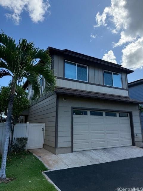 91-1160 Kamakana St Unit 202, Ewa Beach, HI 96706 - view of front facade with an attached garage and driveway