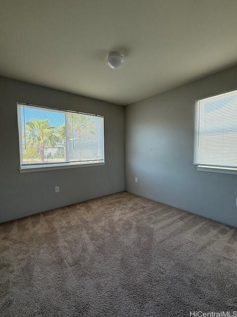 91-1160 Kamakana St Unit 202, Ewa Beach, HI 96706 - carpeted empty room with plenty of natural light