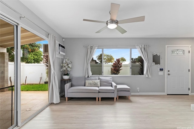 91-1043 Hoomaka St Unit 48, Ewa Beach, HI 96706 - living area featuring light wood-type flooring, ceiling fan, radiator, and baseboards
