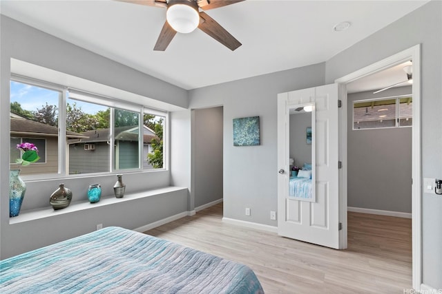 91-1043 Hoomaka St Unit 48, Ewa Beach, HI 96706 - bedroom featuring a walk in closet, wood finished floors, baseboards, and ceiling fan