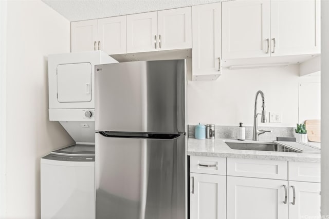 1556 Piikoi St Unit 1802, Honolulu, HI 96822 - clothes washing area featuring stacked washing machine and dryer