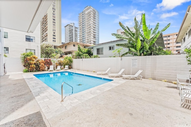 1556 Piikoi St Unit 1802, Honolulu, HI 96822 - community pool featuring a patio and fence