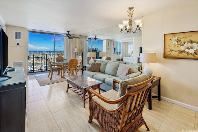 1765 Ala Moana Blvd Unit 790, Honolulu, HI 96815 - living area with light tile patterned flooring, a chandelier, a wall of windows, a ceiling fan, and baseboards